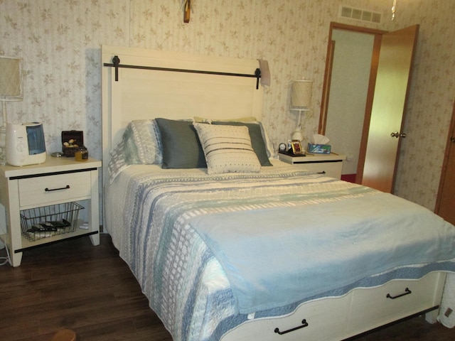 5189 Pinecrest Dr, Lewiston, MI 49756 - bedroom featuring wallpapered walls and wood finished floors