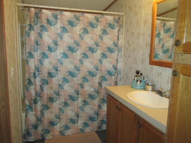 5189 Pinecrest Dr, Lewiston, MI 49756 - bathroom featuring wallpapered walls, vanity, and curtained shower