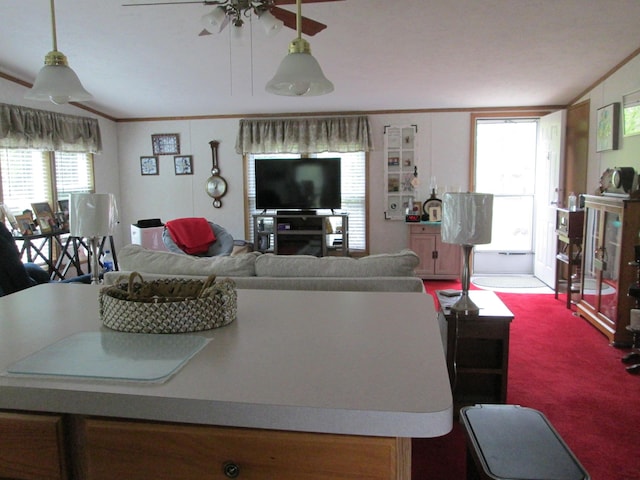 5189 Pinecrest Dr, Lewiston, MI 49756 - carpeted living room featuring a ceiling fan and ornamental molding