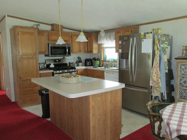 5189 Pinecrest Dr, Lewiston, MI 49756 - kitchen featuring stainless steel appliances, a sink, light countertops, decorative light fixtures, and a center island