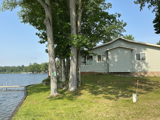 3606 S St, Lupton, MI 48635 - view of grassy yard featuring a water view and a dock