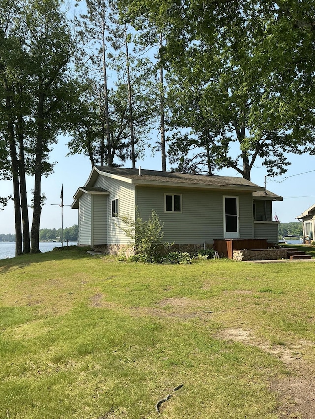 3606 S St, Lupton, MI 48635 - back of property with a yard and a water view