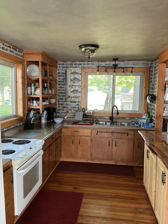 3606 S St, Lupton, MI 48635 - kitchen featuring white range with electric stovetop, dark wood-style floors, and open shelves