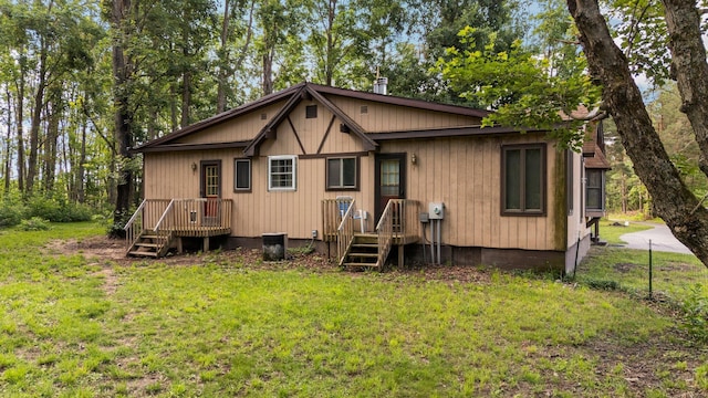 3065 E Dixon Lake Rd, Gaylord, MI 49735 - rear view of property with a lawn