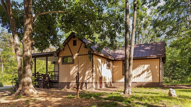 3065 E Dixon Lake Rd, Gaylord, MI 49735 - view of property exterior featuring a metal roof