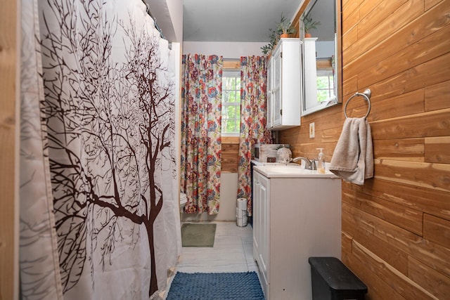 3065 E Dixon Lake Rd, Gaylord, MI 49735 - bathroom with vanity and wood walls