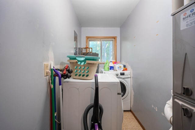 3065 E Dixon Lake Rd, Gaylord, MI 49735 - washroom featuring washer and dryer and baseboards