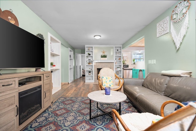 3065 E Dixon Lake Rd, Gaylord, MI 49735 - living area with a fireplace and wood finished floors