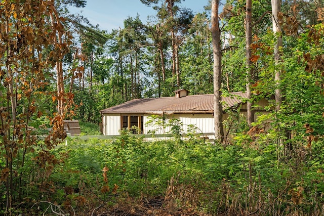 3065 E Dixon Lake Rd, Gaylord, MI 49735 - view of property exterior featuring board and batten siding and a metal roof