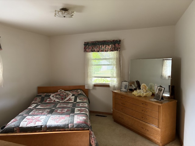 119 Kelly Rd, Alpena, MI 49707 - bedroom featuring light carpet