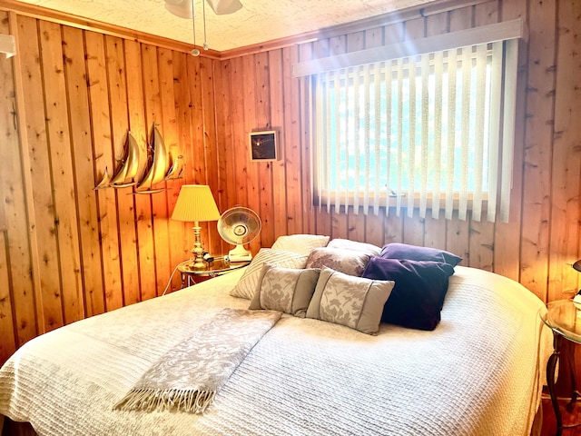7811 Mcdonald Rd, Cheboygan, MI 49721 - bedroom with wood walls and a ceiling fan