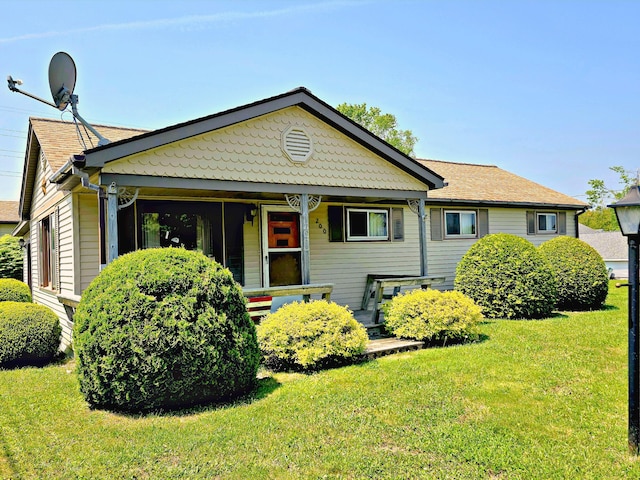 200 S 1st St, Saint Ignace, MI 49781 - view of front of house with a front yard and covered porch