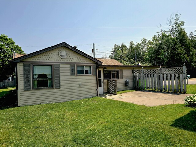 200 S 1st St, Saint Ignace, MI 49781 - back of property featuring a patio