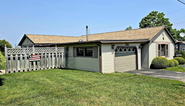 200 S 1st St, Saint Ignace, MI 49781 - view of property exterior featuring a garage, a shingled roof, and asphalt driveway