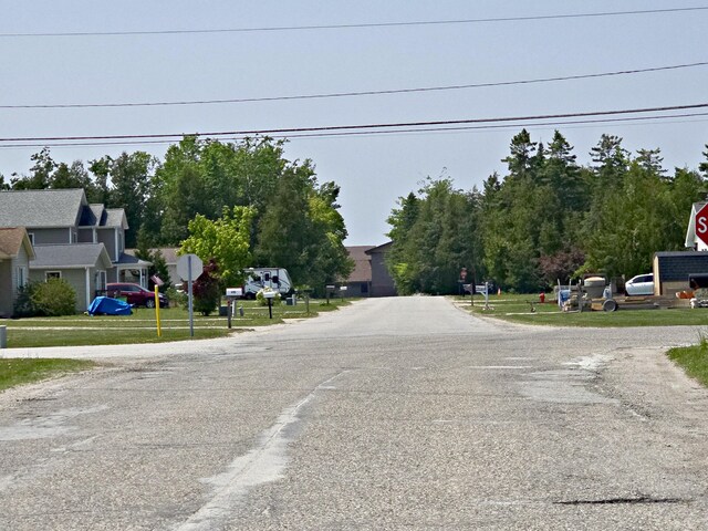 200 S 1st St, Saint Ignace, MI 49781 - view of asphalt road featuring traffic signs