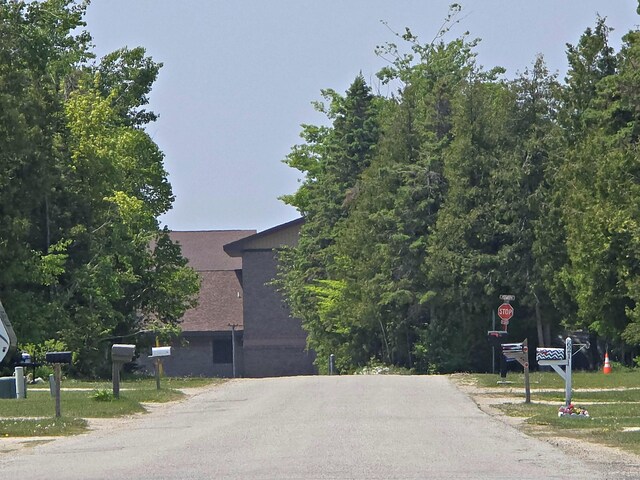 200 S 1st St, Saint Ignace, MI 49781 - view of asphalt street featuring traffic signs