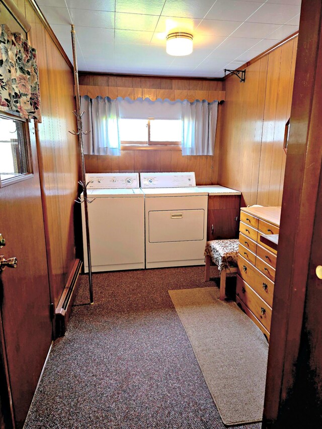 200 S 1st St, Saint Ignace, MI 49781 - laundry room featuring washing machine and clothes dryer, wood walls, and baseboard heating