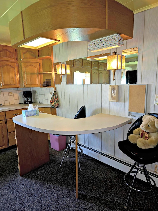 200 S 1st St, Saint Ignace, MI 49781 - kitchen featuring light countertops, brown cabinets, decorative backsplash, open shelves, and wooden walls