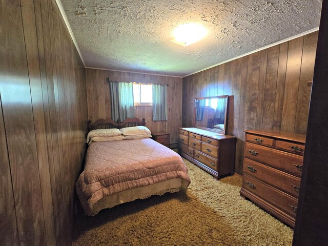 200 S 1st St, Saint Ignace, MI 49781 - bedroom with a textured ceiling, wooden walls, light colored carpet, and crown molding