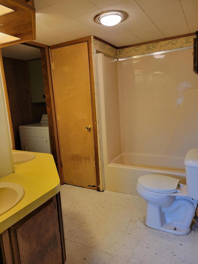 14089 M65, Posen, MI 49776 - bathroom with washer / dryer, toilet, tile patterned floors, and shower / bathtub combination