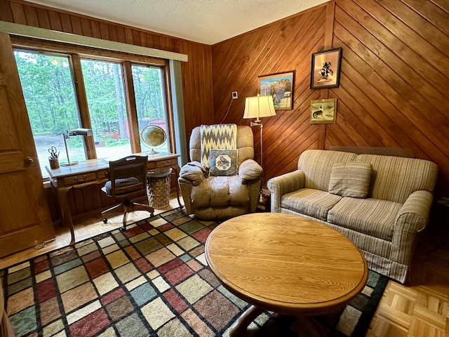 9561 Highbanks Dr, Cheboygan, MI 49721 - sitting room featuring wooden walls, a desk, and a textured ceiling