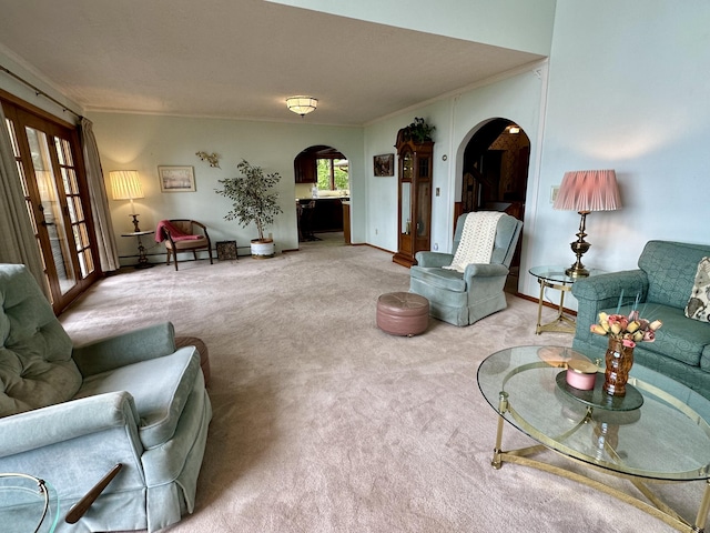 9561 Highbanks Dr, Cheboygan, MI 49721 - living area with arched walkways, carpet flooring, and ornamental molding
