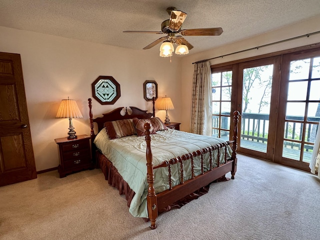9561 Highbanks Dr, Cheboygan, MI 49721 - bedroom featuring access to exterior, light carpet, a textured ceiling, french doors, and a ceiling fan