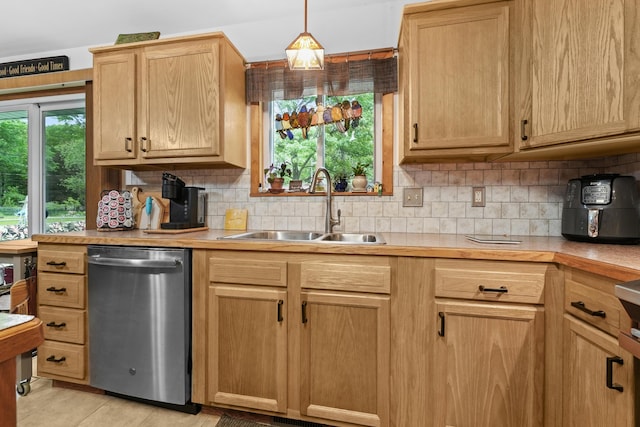 104 Alpena Trl, Houghton Lake, MI 48629 - kitchen featuring stainless steel dishwasher, tasteful backsplash, light countertops, and light brown cabinets