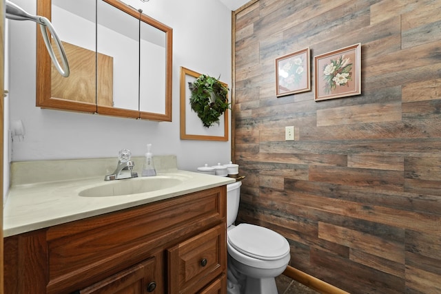 104 Alpena Trl, Houghton Lake, MI 48629 - half bathroom featuring vanity and wooden walls