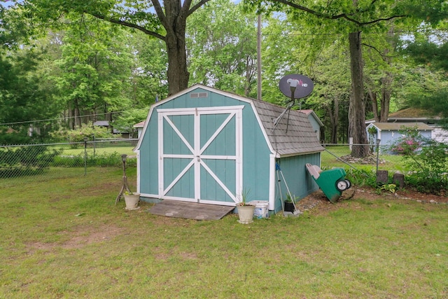 104 Alpena Trl, Houghton Lake, MI 48629 - view of shed with view of wooded area