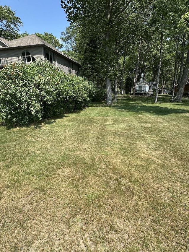 104 Alpena Trl, Houghton Lake, MI 48629 - view of grassy yard