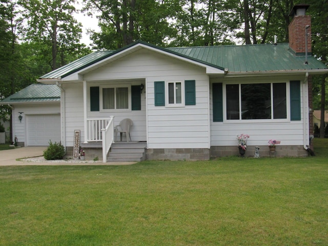 110 Chippewa Trl, Prudenville, MI 48651 - single story home featuring a garage, a chimney, driveway, a front yard, and a metal roof
