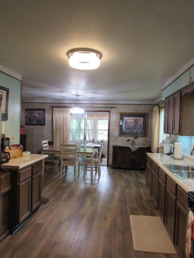 110 Chippewa Trl, Prudenville, MI 48651 - kitchen with light countertops, dark wood-style floors, a chandelier, and dark brown cabinets
