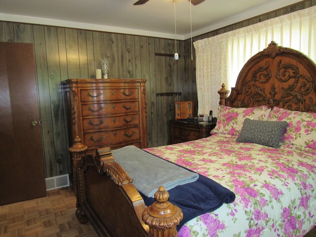 110 Chippewa Trl, Prudenville, MI 48651 - bedroom with wood walls and a ceiling fan