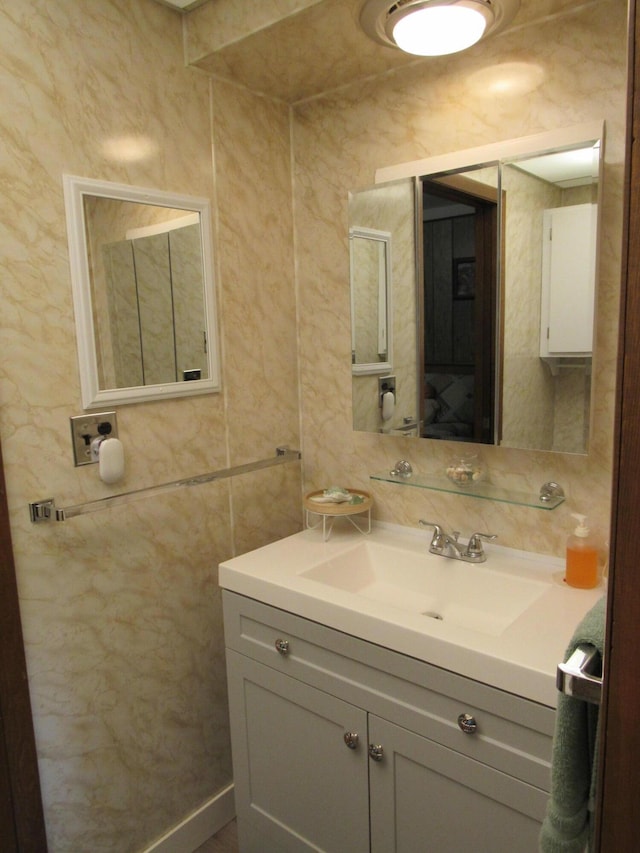 110 Chippewa Trl, Prudenville, MI 48651 - bathroom featuring vanity and tile walls