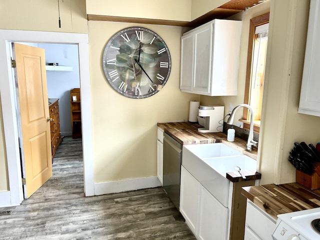 300 E Blair St, Alpena, MI 49707 - kitchen with dishwasher, dark wood-style flooring, butcher block counters, and white cabinetry