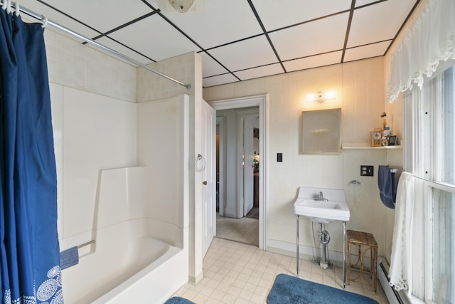 757 N Main St, Cheboygan, MI 49721 - bathroom featuring shower / bath combo, tile patterned floors, and a baseboard radiator