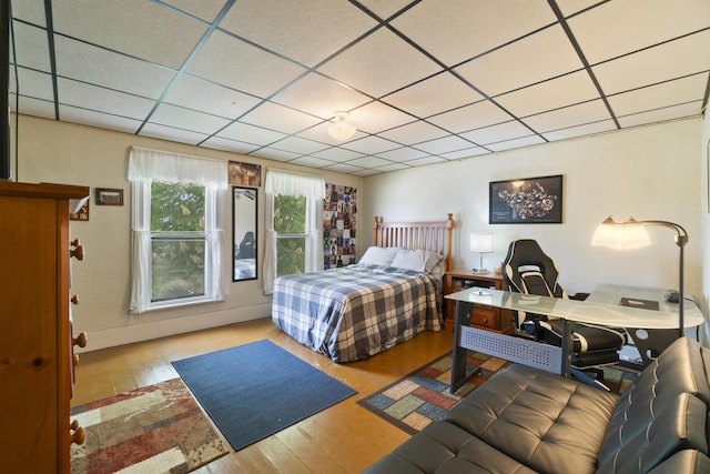 757 N Main St, Cheboygan, MI 49721 - bedroom with wood finished floors and a paneled ceiling
