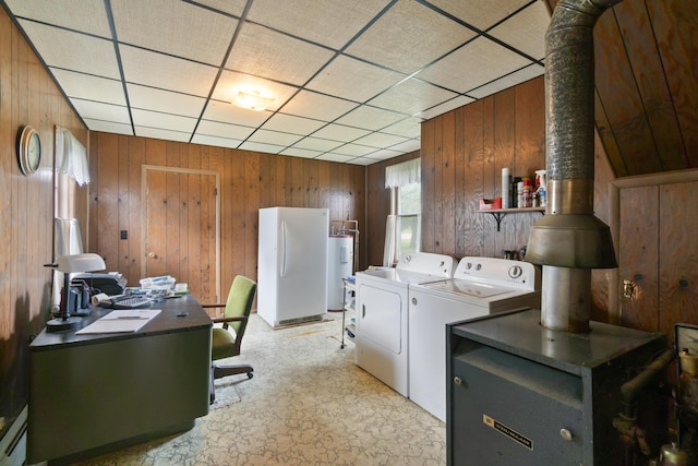 757 N Main St, Cheboygan, MI 49721 - laundry area with washing machine and dryer, wooden walls, water heater, baseboard heating, and an office area