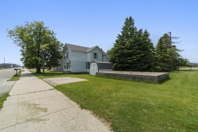 757 N Main St, Cheboygan, MI 49721 - view of property exterior with a storage shed and a lawn