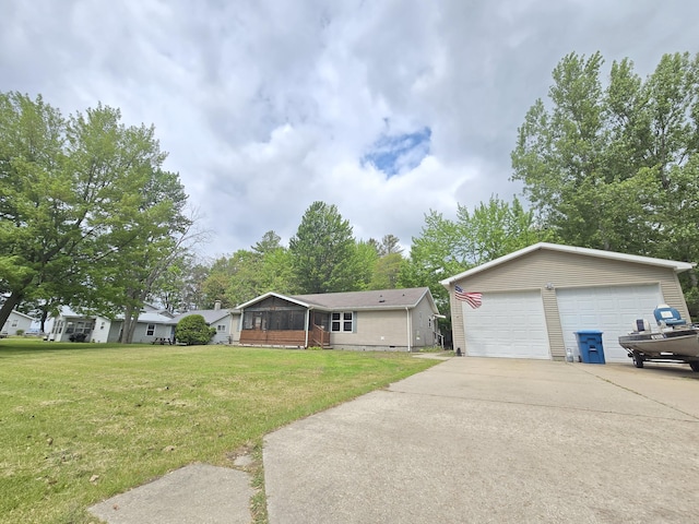 6709C E Houghton Lake Dr, Houghton Lake, MI 48629 - ranch-style home featuring a detached garage, a front yard, and an outbuilding