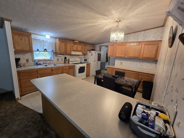 6709C E Houghton Lake Dr, Houghton Lake, MI 48629 - kitchen with white appliances, wallpapered walls, lofted ceiling, a chandelier, and crown molding