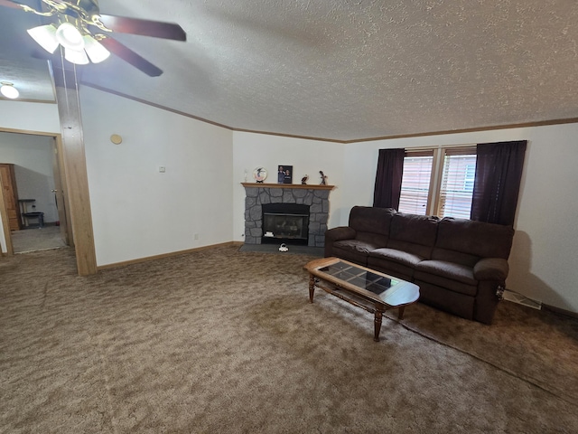 6709C E Houghton Lake Dr, Houghton Lake, MI 48629 - carpeted living room featuring a textured ceiling, ornamental molding, a ceiling fan, and a fireplace