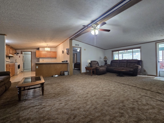 6709C E Houghton Lake Dr, Houghton Lake, MI 48629 - living area featuring lofted ceiling, a textured ceiling, ceiling fan, and light colored carpet