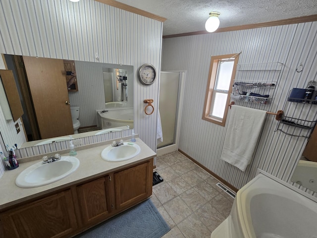6709C E Houghton Lake Dr, Houghton Lake, MI 48629 - full bathroom featuring ornamental molding, a tub to relax in, a textured ceiling, an enclosed shower, and double vanity