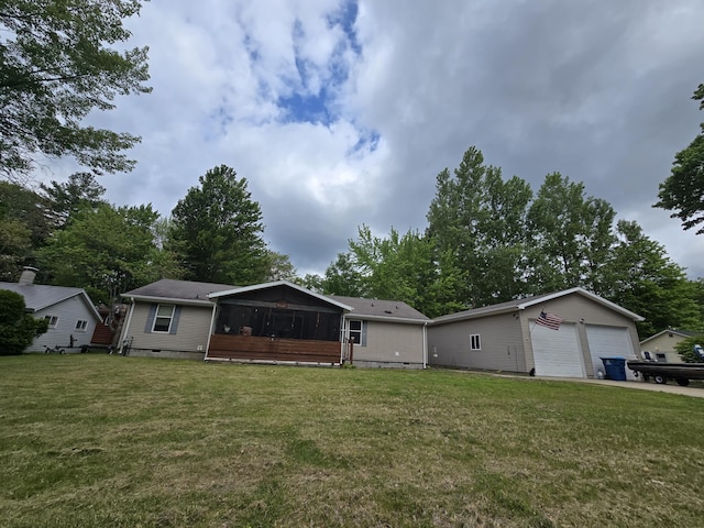 6709C E Houghton Lake Dr, Houghton Lake, MI 48629 - view of front of house with a sunroom, a front lawn, a detached garage, and crawl space