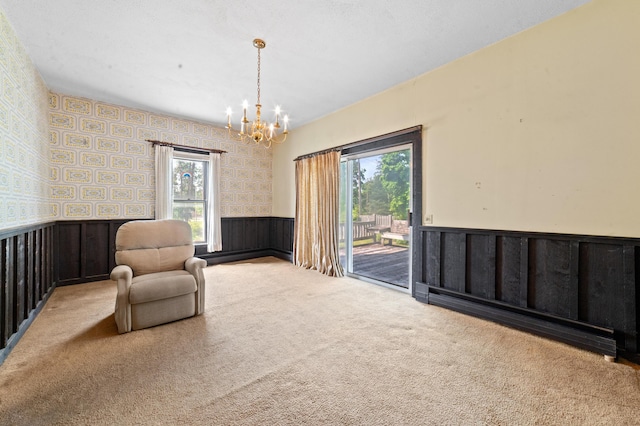 220 E Main St, Gaylord, MI 49735 - sitting room with wainscoting, plenty of natural light, carpet floors, a chandelier, and wallpapered walls