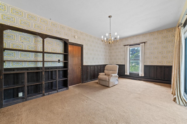 220 E Main St, Gaylord, MI 49735 - sitting room featuring wallpapered walls, carpet flooring, a chandelier, and wainscoting