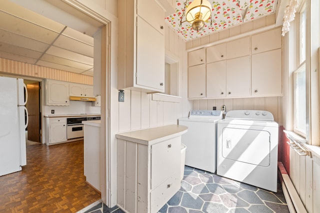 220 E Main St, Gaylord, MI 49735 - washroom with cabinet space and washing machine and clothes dryer