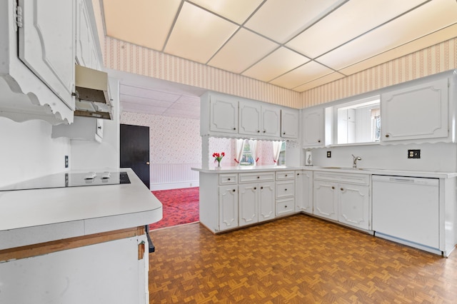 220 E Main St, Gaylord, MI 49735 - kitchen featuring wallpapered walls, dishwasher, custom exhaust hood, black electric stovetop, and a peninsula